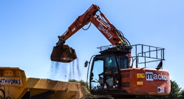 Earthworks digger mound reduction for Mackoy Groundworks
