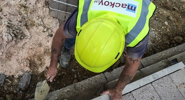 Groundworks Operative working on sub-structure birckwork for Mackoy Groundworks