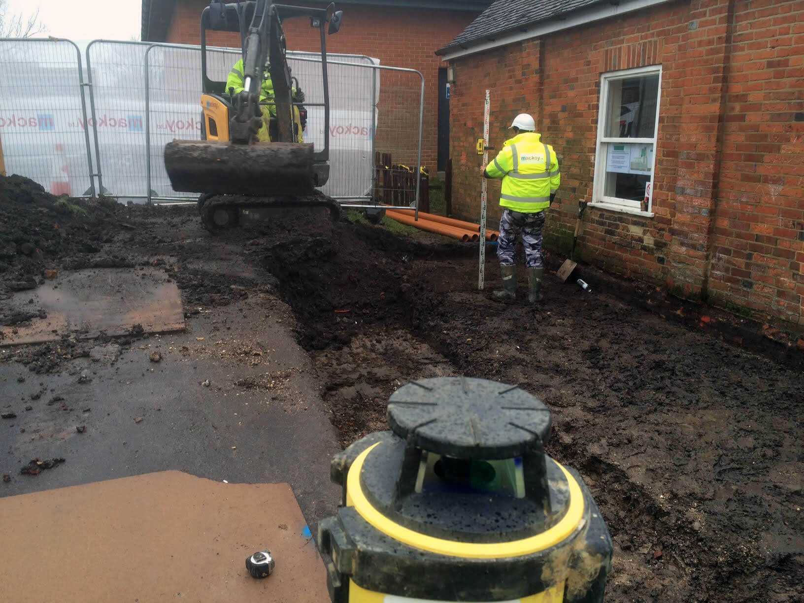 Mackoy Groundworker on Site at Jane Scarth Charity Project Working with Excavator