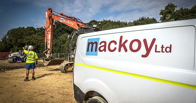 Mackoy Ltd Branded Plant Machinery Van and Digger on Site