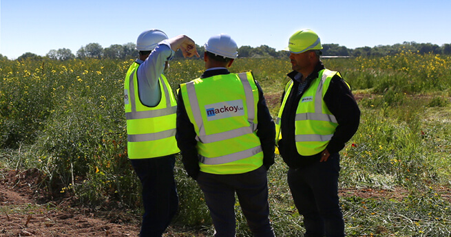 Mackoy Ltd Groundworks and Civil Engineering Operatives Gathering on Site to Discuss Further Earthworks