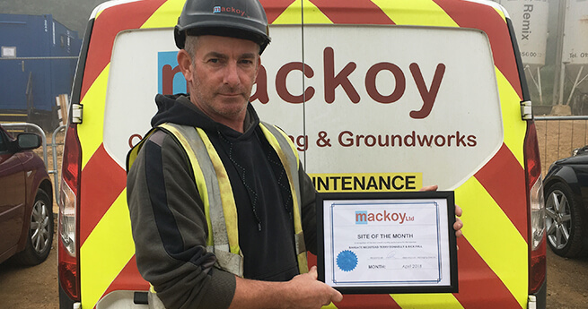 Site of the Month Award Winner April in Front of Mackoy Groundworks and Civil Engineering Branded Van