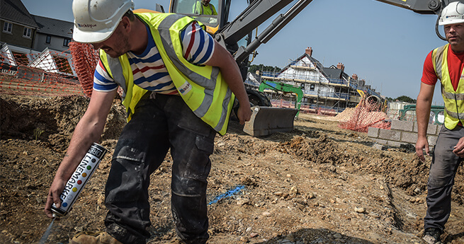 Mackoy Groundworker Marking Out for Trench Digging on Site