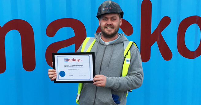 Mackoy Foreman of the Month for October with award in hand on Groundworks site