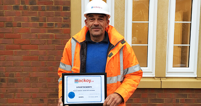 Mackoy Site of the Month Winner for October with award on site