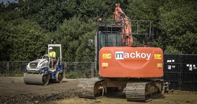 Mackoy Plant Machinery on site roller and excavator